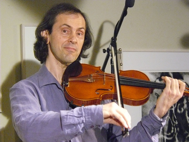 Michael Snow playing violin at Unison Arts Center in New Paltz, NY